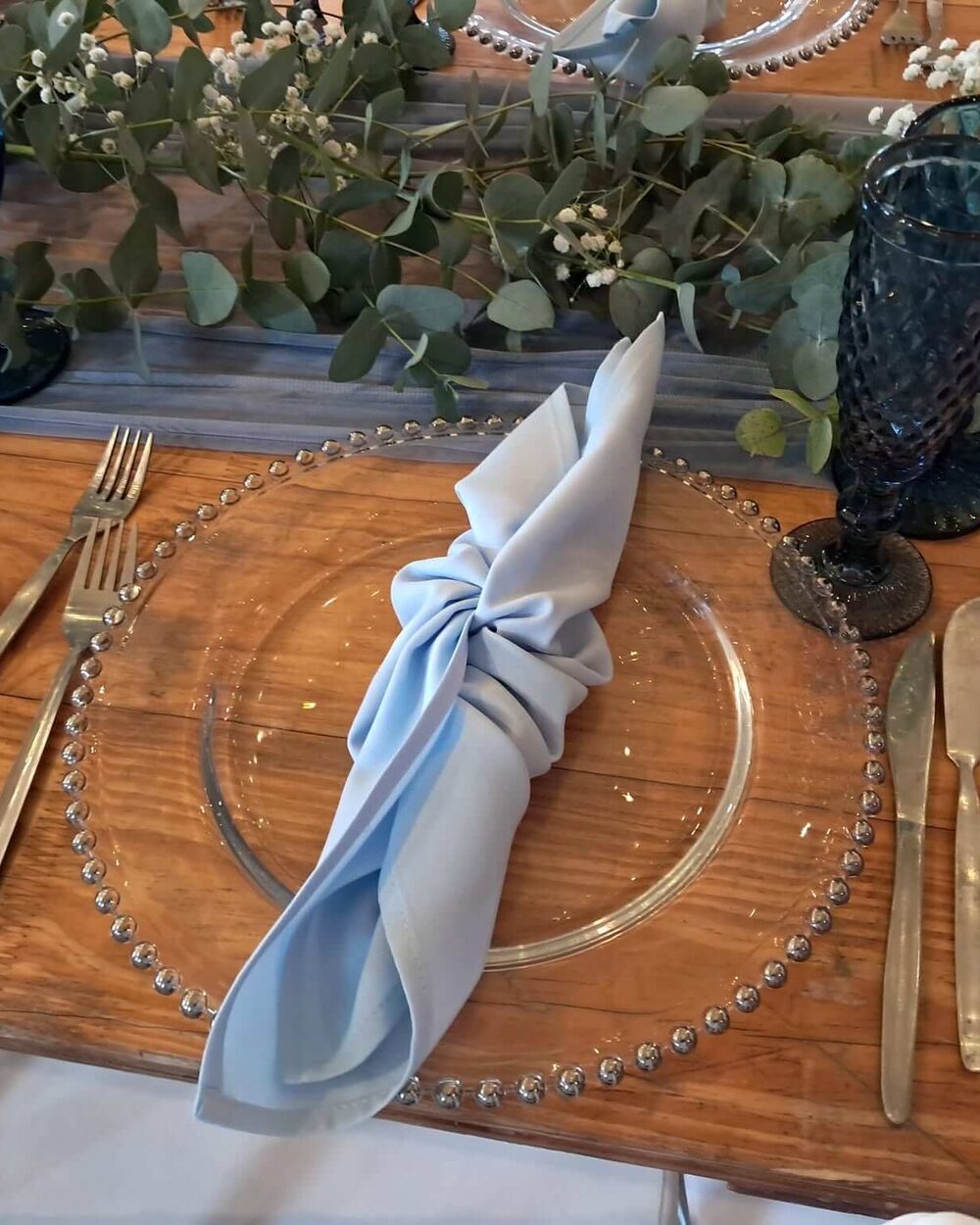 A formal dinner setting by Creations with elegant table styling and place settings, suited to corporate dinners and functions